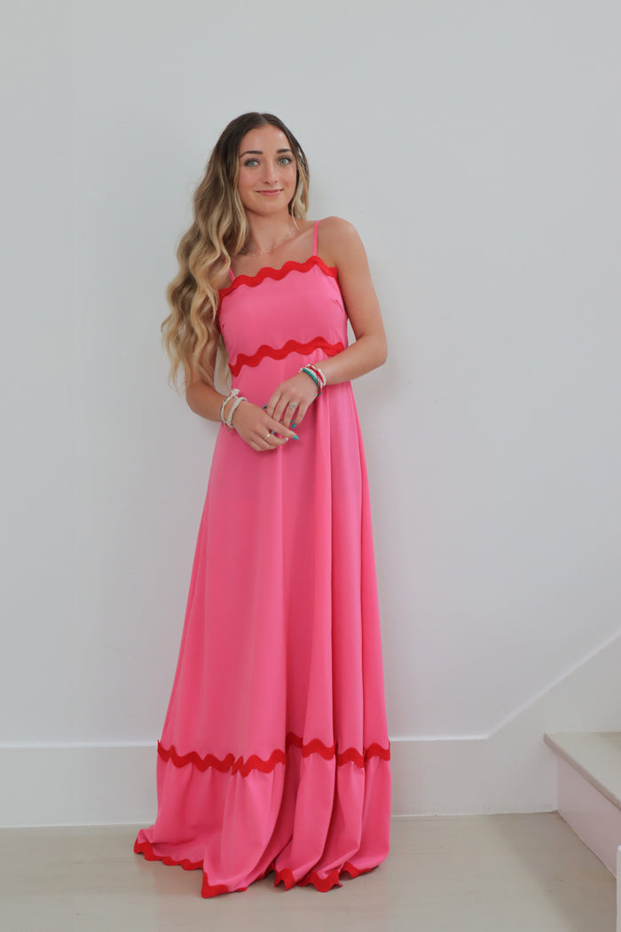 girl wearing pink long dress with chevron detailing