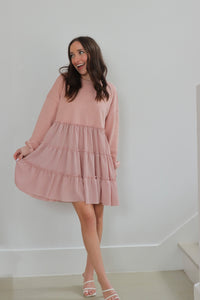 girl wearing pastel pink long sleeve tulle dress