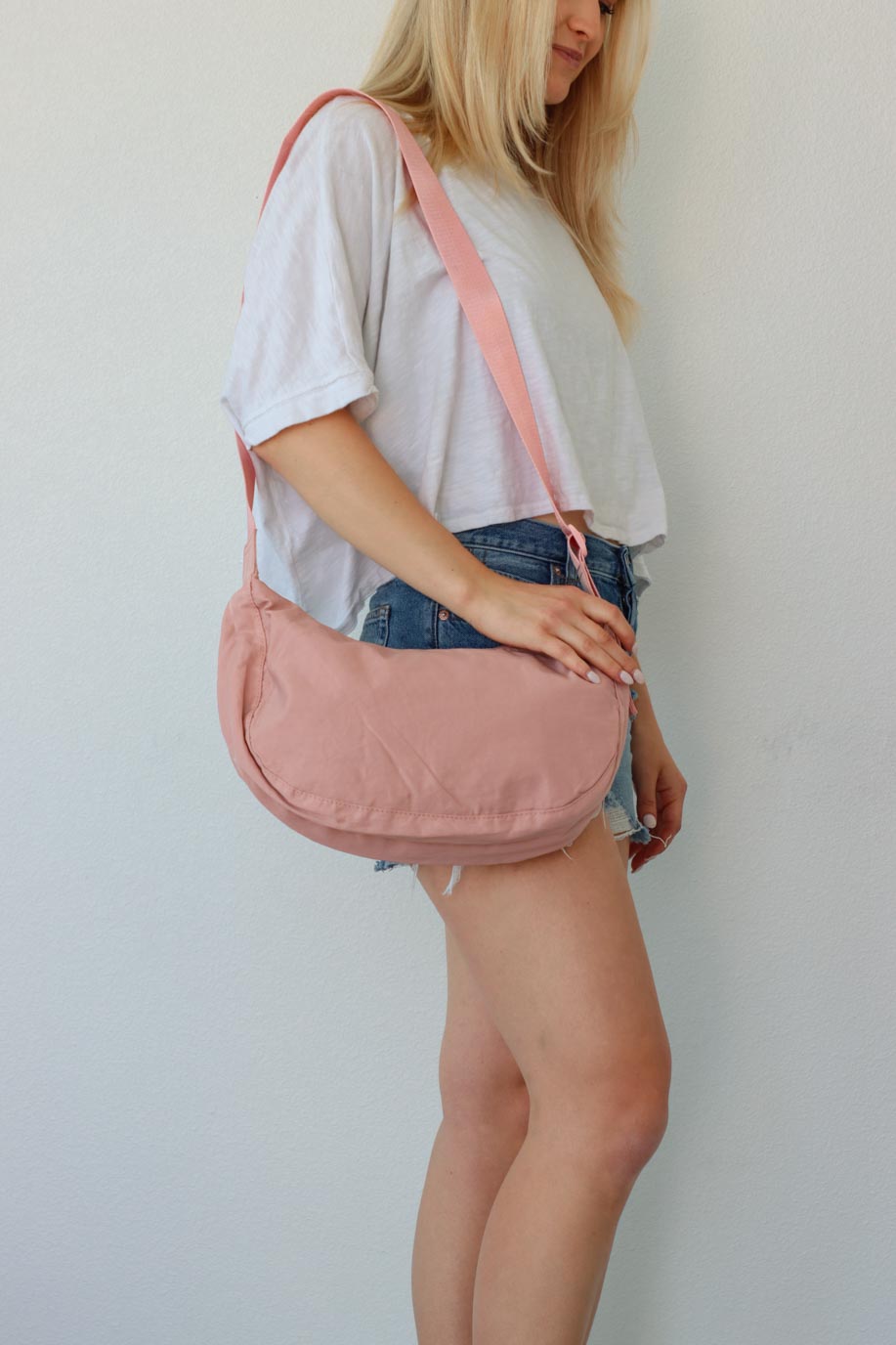 girl carrying pink nylon bag