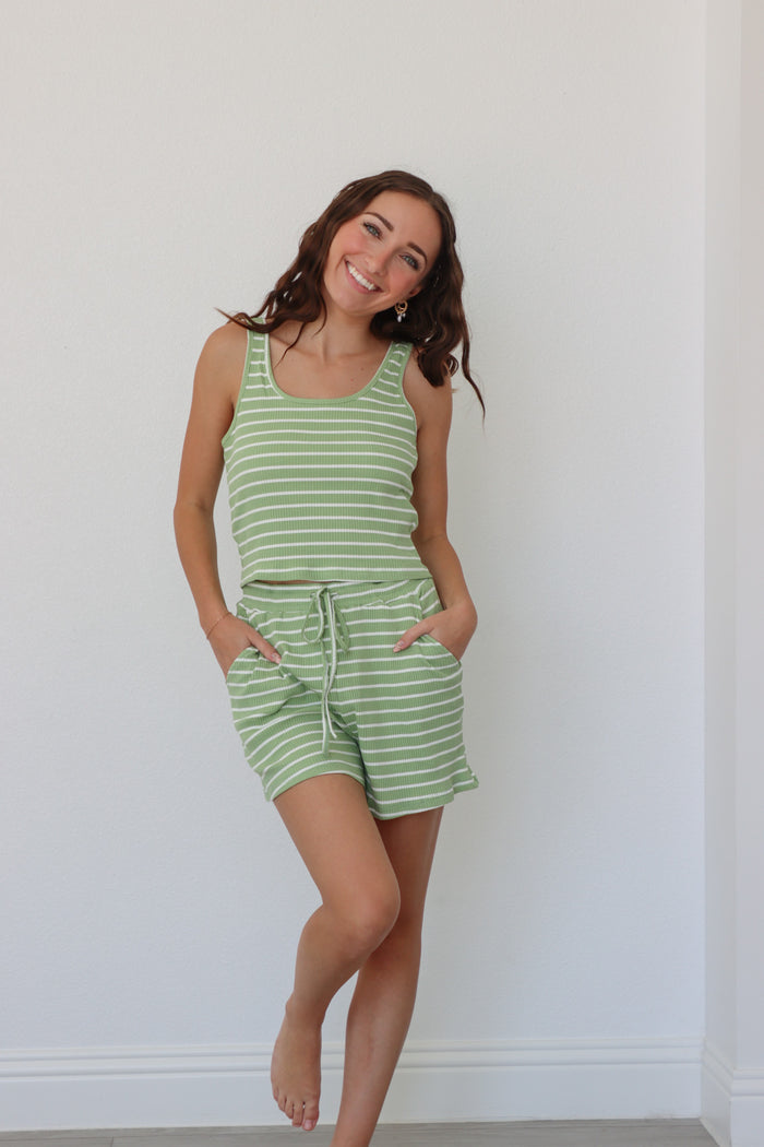 girl wearing light green striped matching lounge set