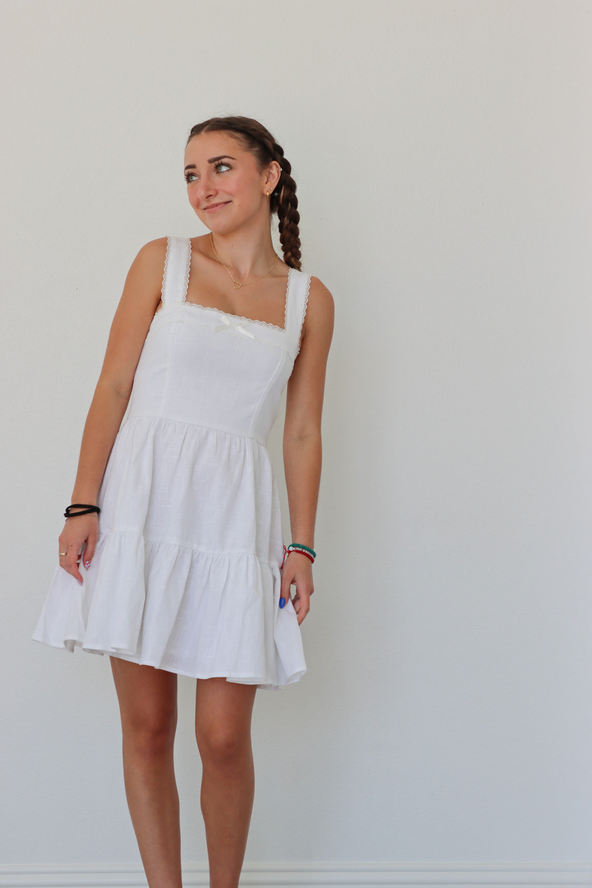 girl wearing short white dress