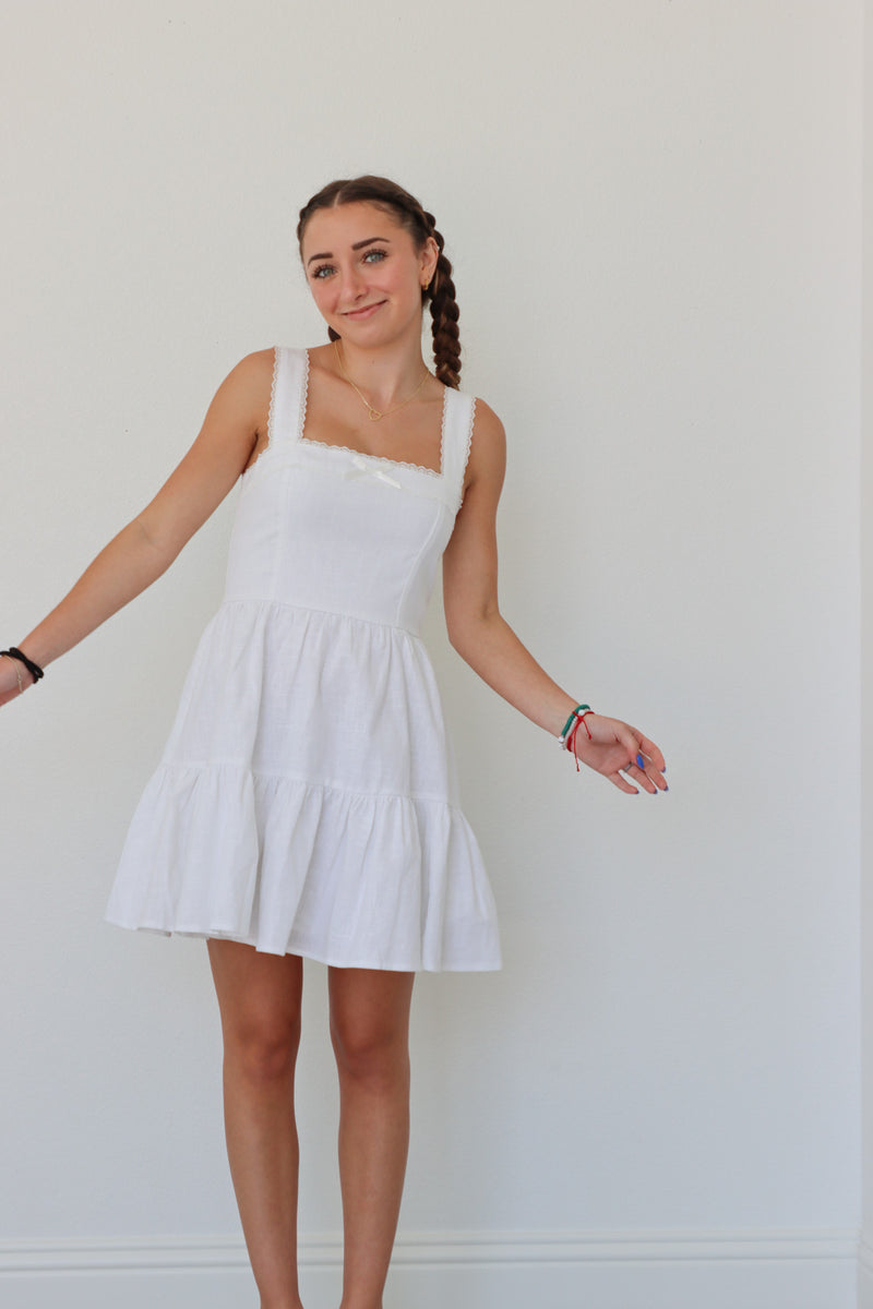 girl wearing short white dress