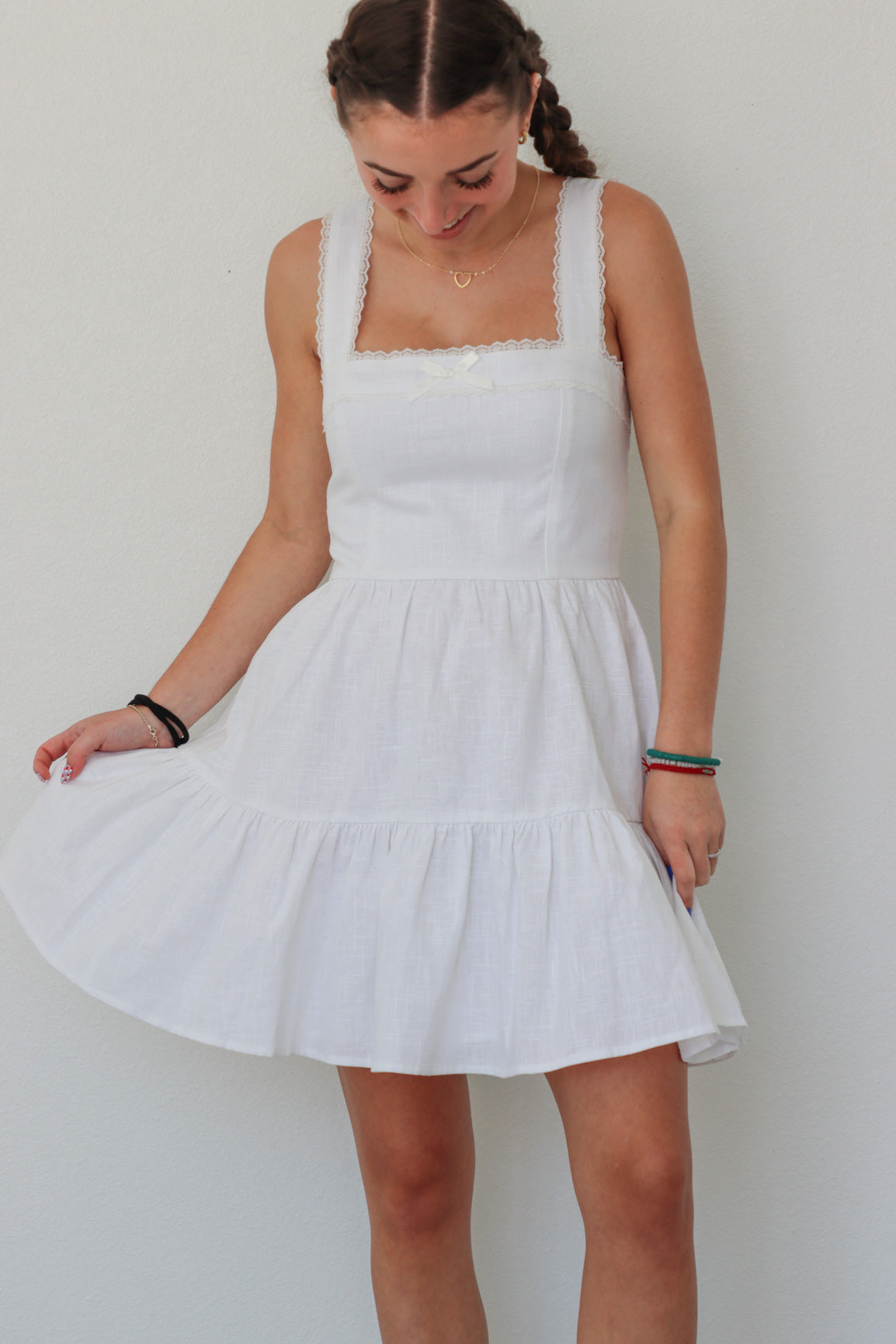 girl wearing short white dress