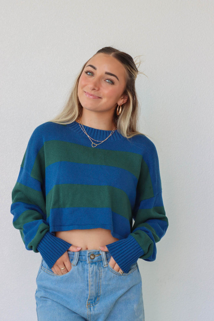 girl wearing blue and green striped knit cropped sweater