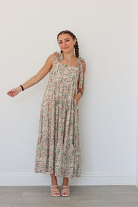 girl wearing multicolor long floral dress