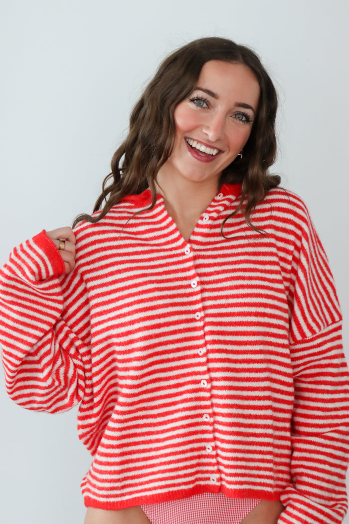 girl in red/white striped cardigan