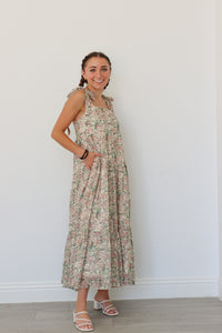 girl wearing multicolor long floral dress