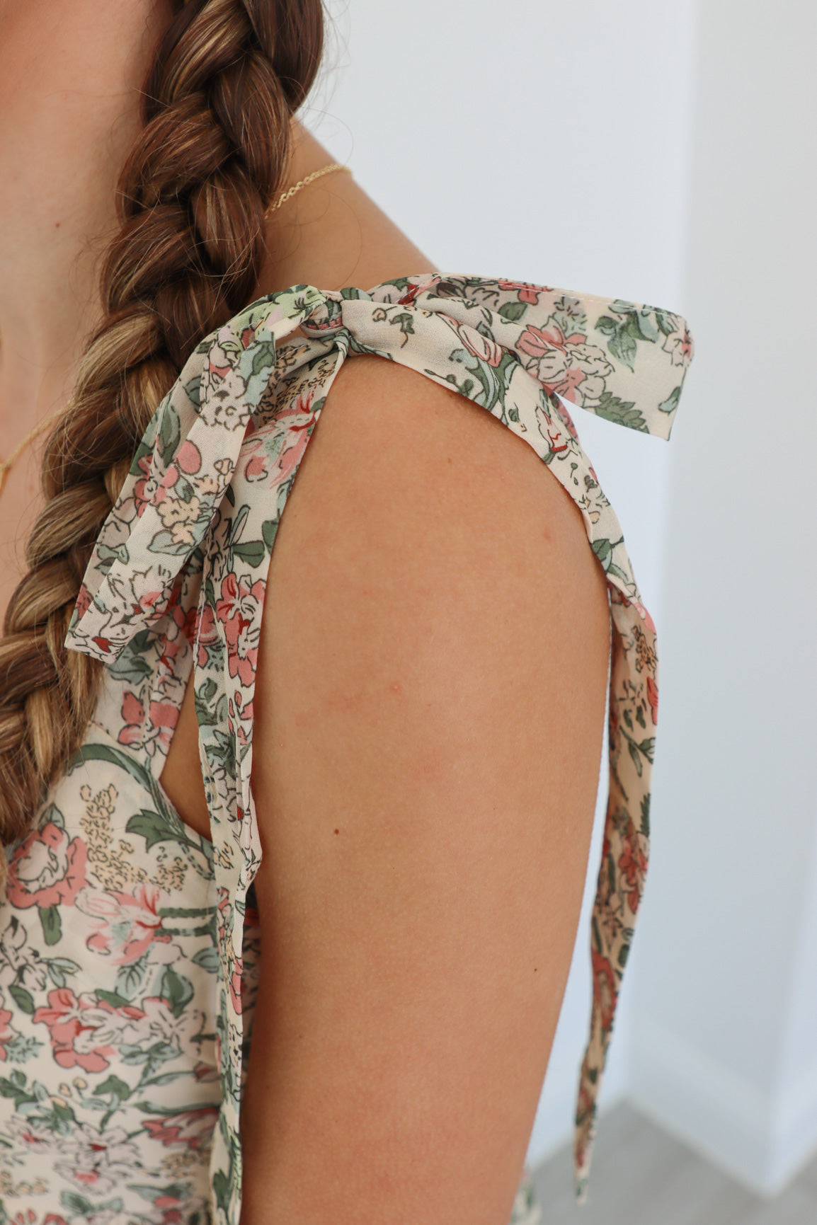 girl wearing multicolor long floral dress