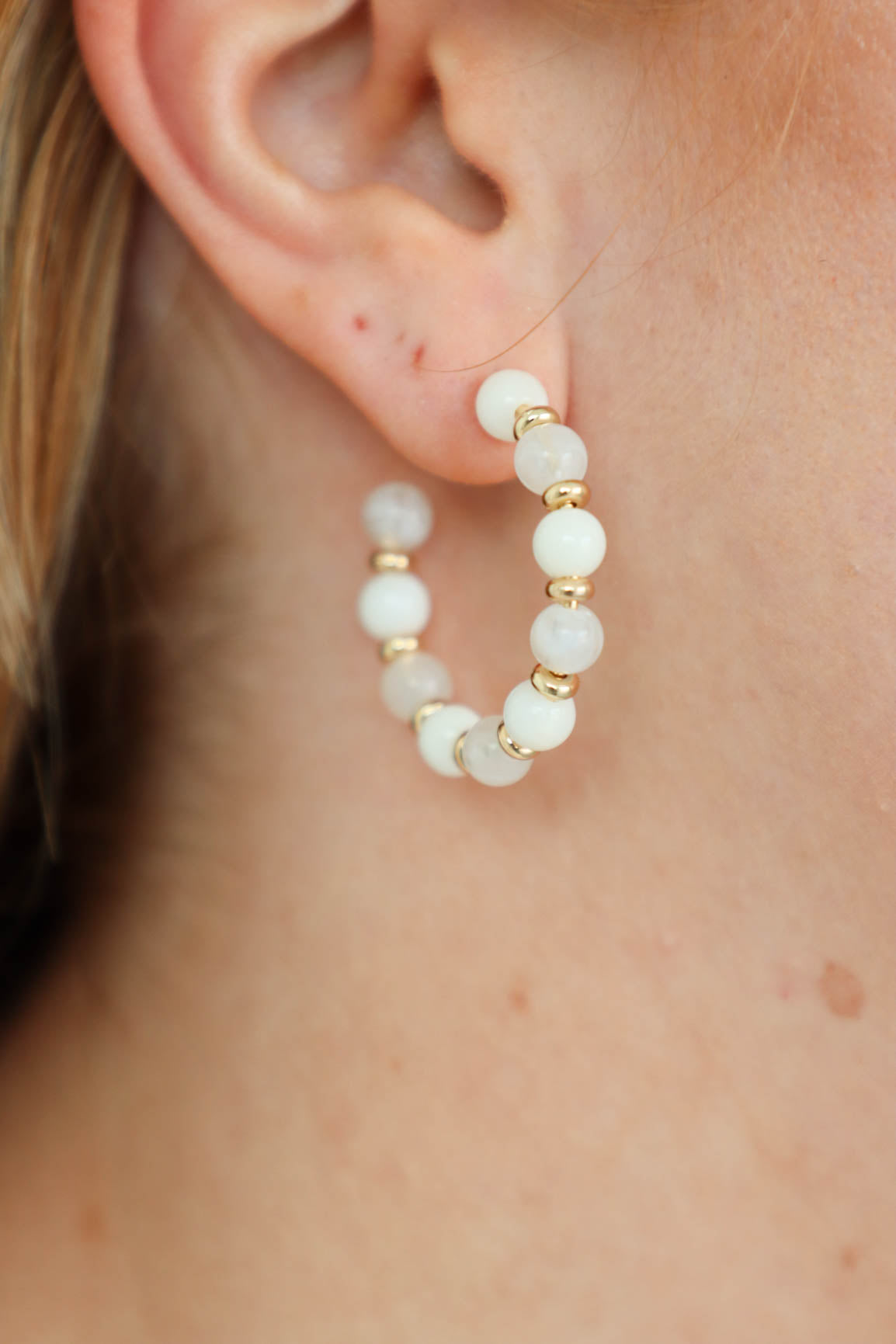 white beaded hoop earrings with gold detailing
