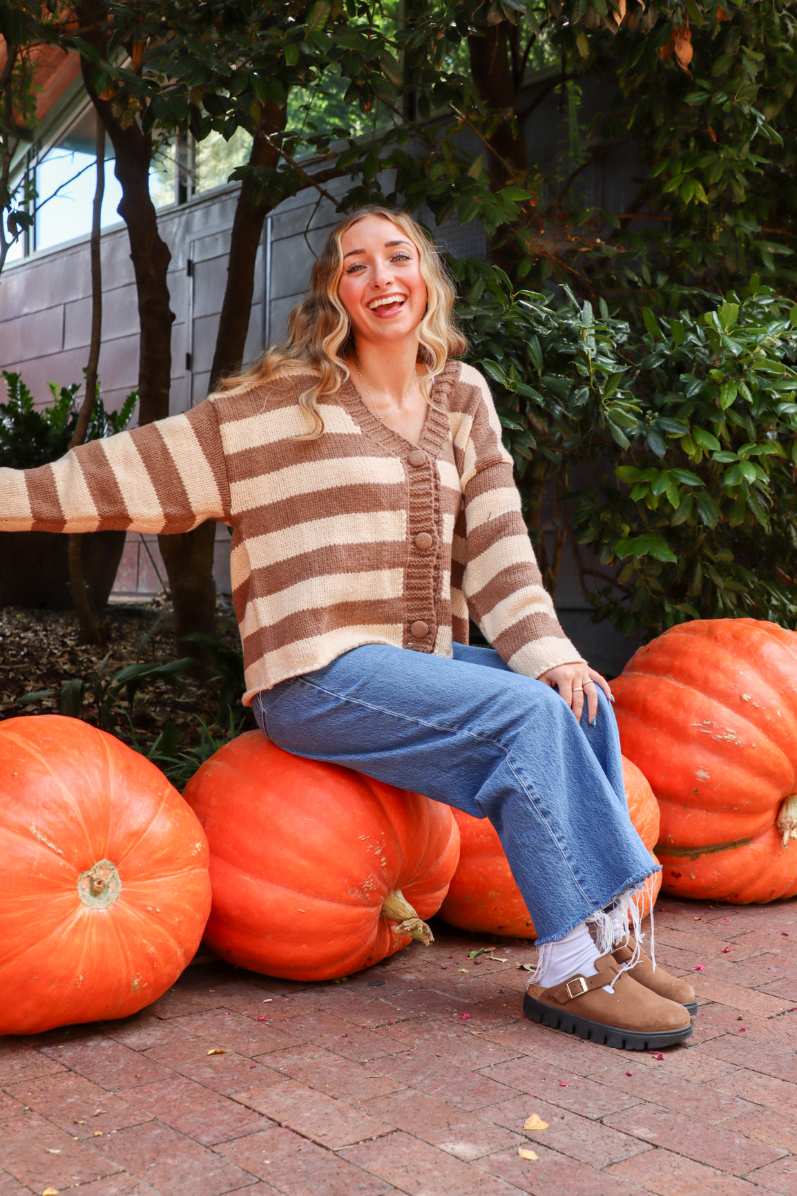 woman wearing brown and cream striped cardigan