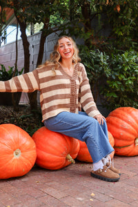 woman wearing brown and cream striped cardigan