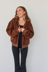 girl wearing dark brown hoodie