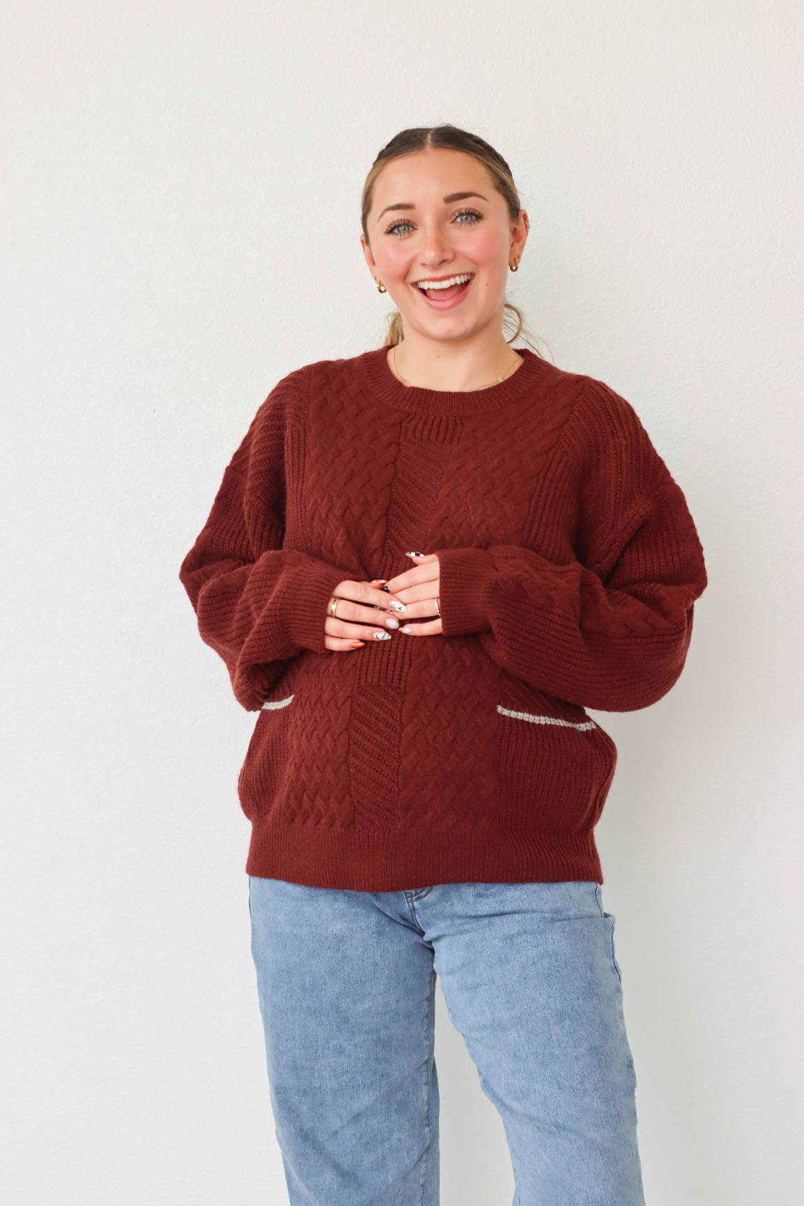 girl wearing dark red knit sweater