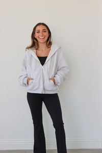 girl wearing light gray hoodie