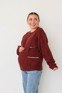 girl wearing dark red knit sweater