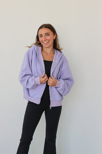 girl wearing periwinkle hoodie