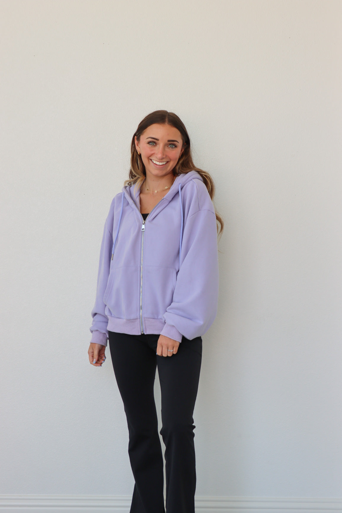 girl wearing periwinkle hoodie