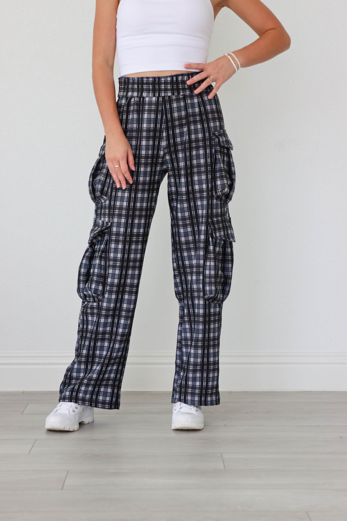 girl wearing blue and black plaid cargo pants