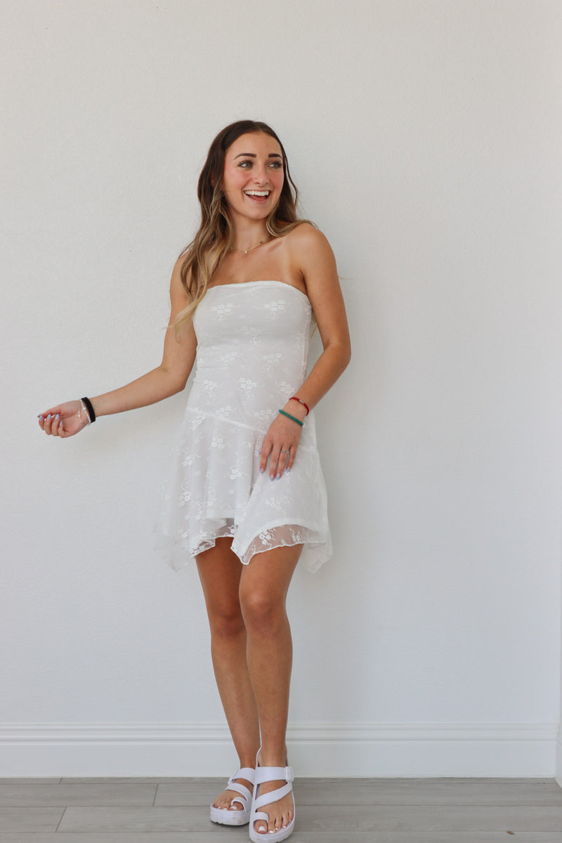 girl wearing white tube top lace dress