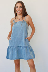 girl wearing denim short dress