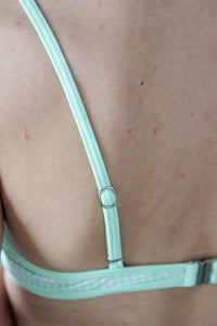 girl wearing mint green gingham bikini