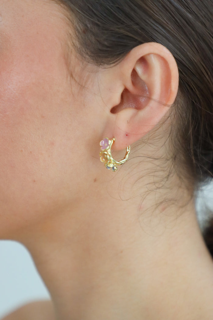 girl wearing multicolor hoop earrings
