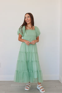 girl wearing mint long dress with tulle detailing