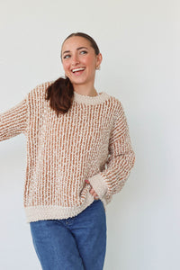 girl wearing tan and cream knit sweater