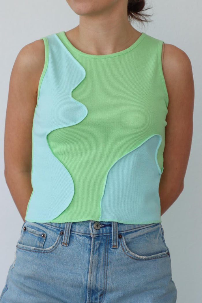 girl wearing green and blue tank top