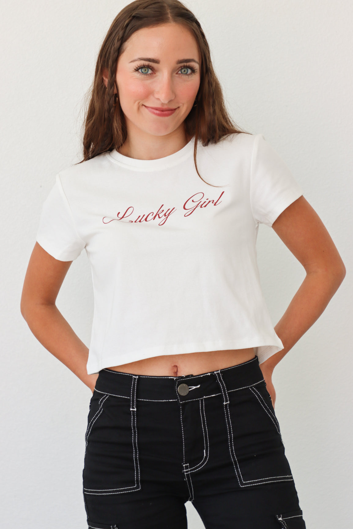 girl wearing white "lucky girl" tee