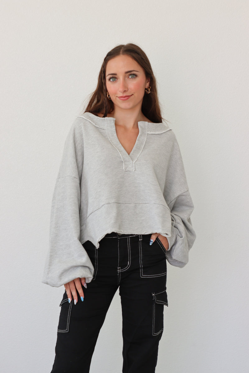 girl wearing heather gray pullover