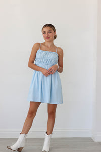 girl wearing light blue short dress