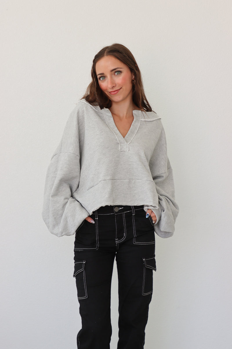 girl wearing heather gray pullover