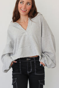 girl wearing heather gray pullover