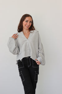 girl wearing heather gray pullover