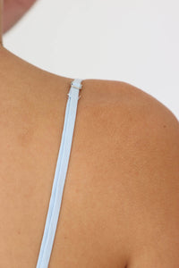 adjustable straps on light blue short dress