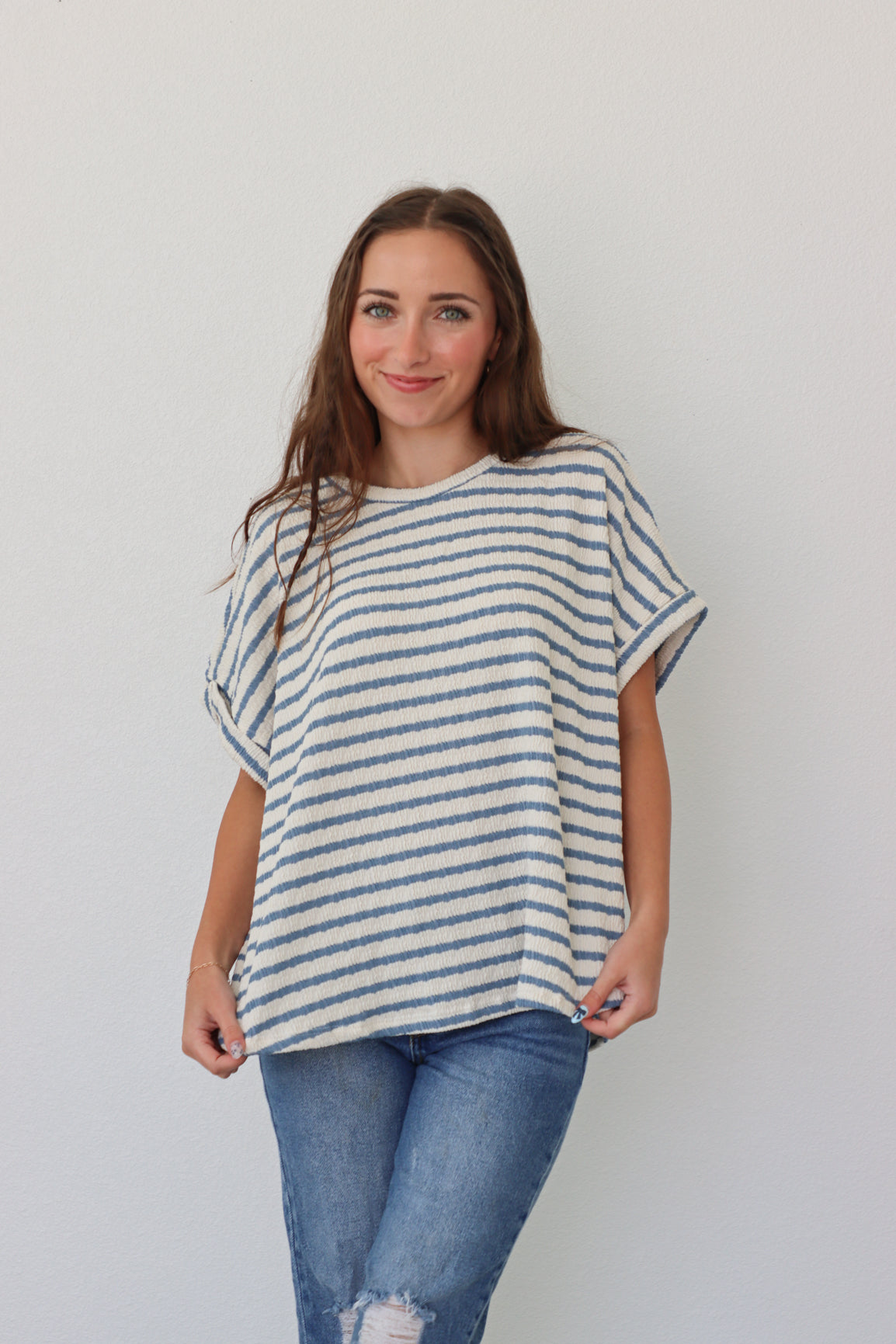 girl wearing white tee with blue stripes