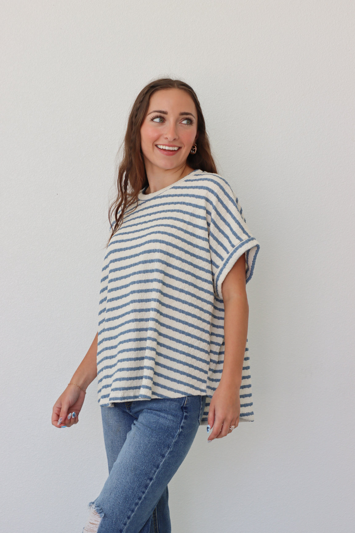 girl wearing white tee with blue stripes