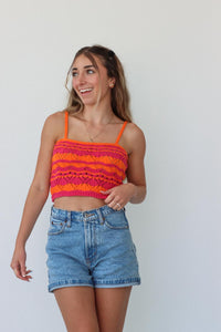 girl wearing pink and orange crochet knit tank top