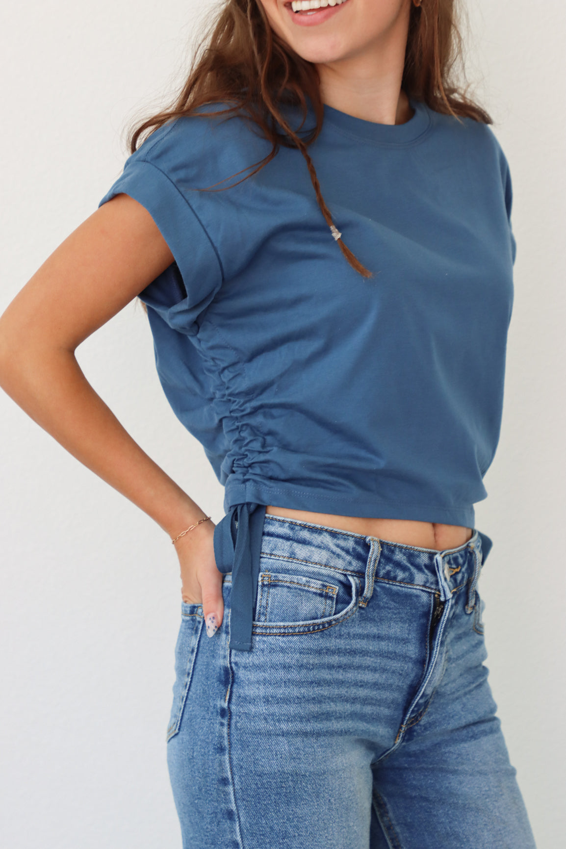 girl wearing dark blue cropped tee