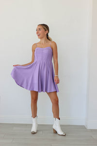 girl wearing light purple short dress