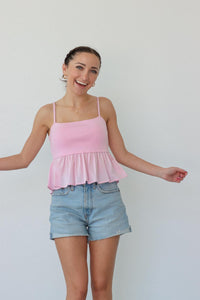 girl wearing pink tank top