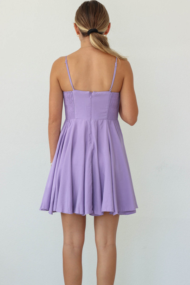 girl wearing light purple short dress