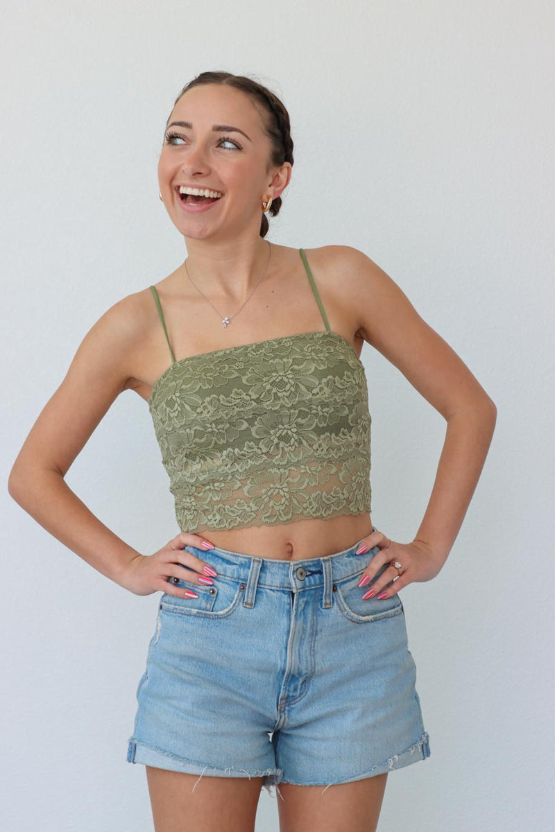 girl wearing green lace cropped tank top