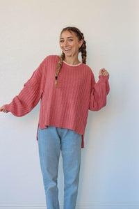 girl wearing dark pink knit sweater