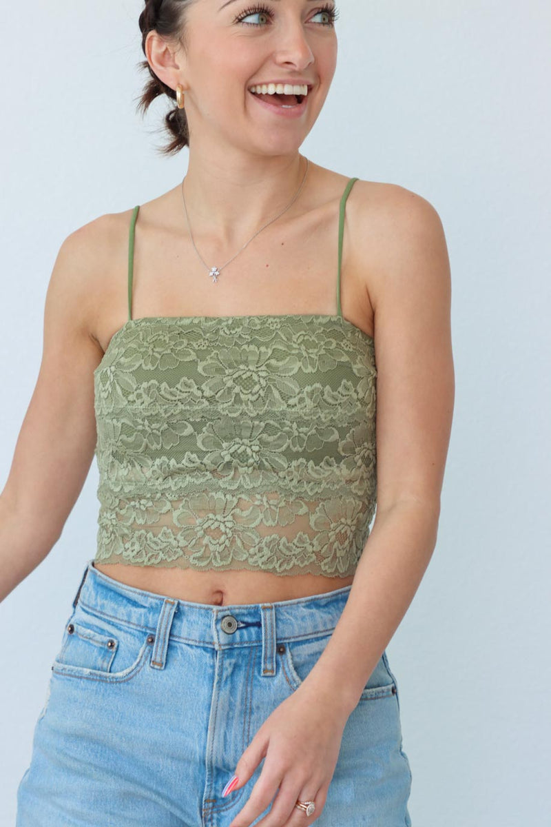 girl wearing green lace cropped tank top