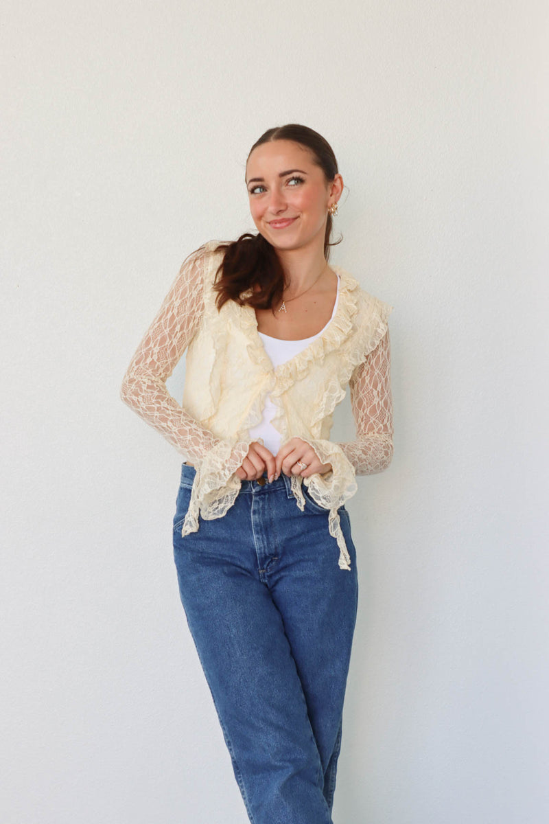 girl wearing cream lace top