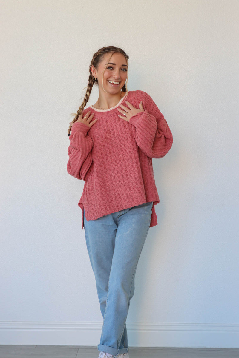 girl wearing dark pink knit sweater