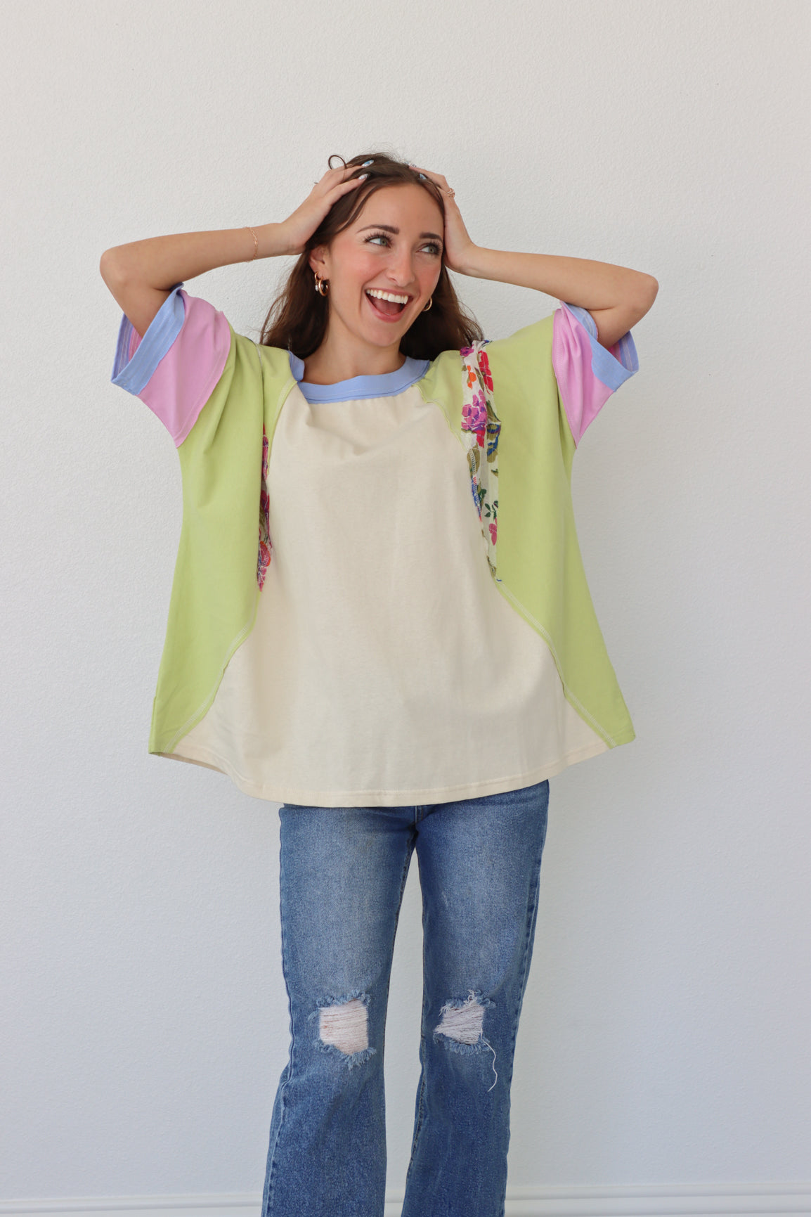 girl wearing loose, floral t-shirt