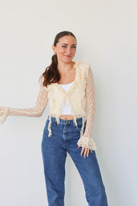 girl wearing cream lace top